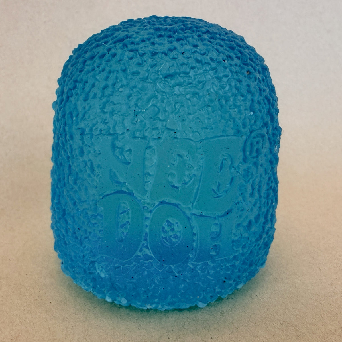 NeeDoh Gumdrop squishy sensory toy in teal, standing
